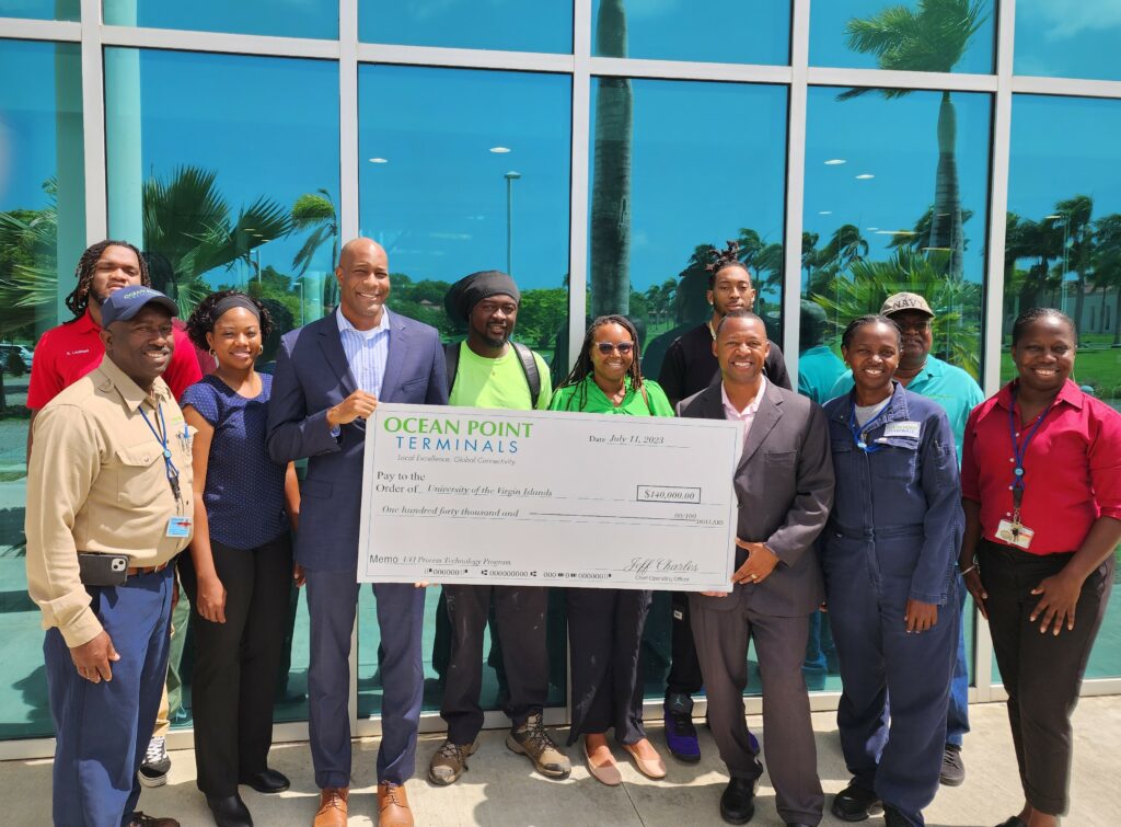 Ocean Point Terminals officials present UVI faculty and students with a check
donation for the UVI Process Technology Program.